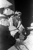 Pathan man smoking a water-pipe