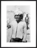 Arab man wearing a palm frond hat