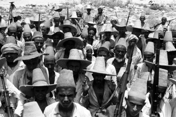 Arab men wearing straw hats