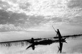 Madan men in a boat in the Marshes