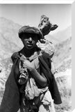 Gujar man carrying a bag