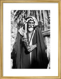 Madan man with a wooden pipe