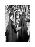 Madan man with a wooden pipe