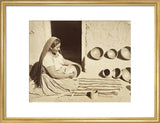 Woman polishing a pottery vessel