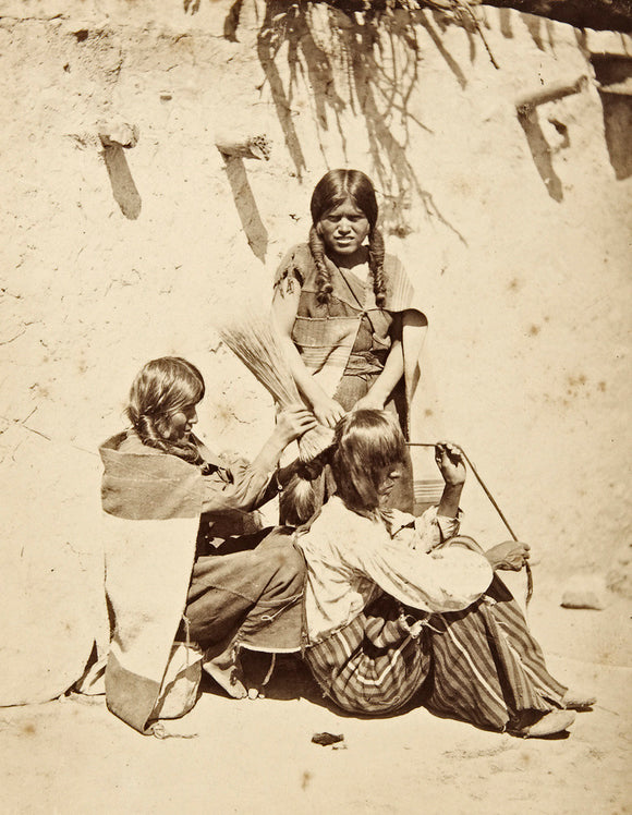 Hopi woman dressing hair