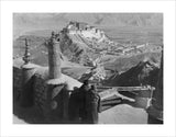 Monks blowing radung, Potala in distance