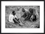 Maasai men playing mancala