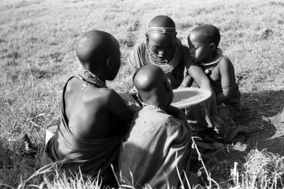 Maasai women preparing ochre