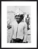 Arab man wearing a palm frond hat