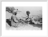 Arab men cutting up meat