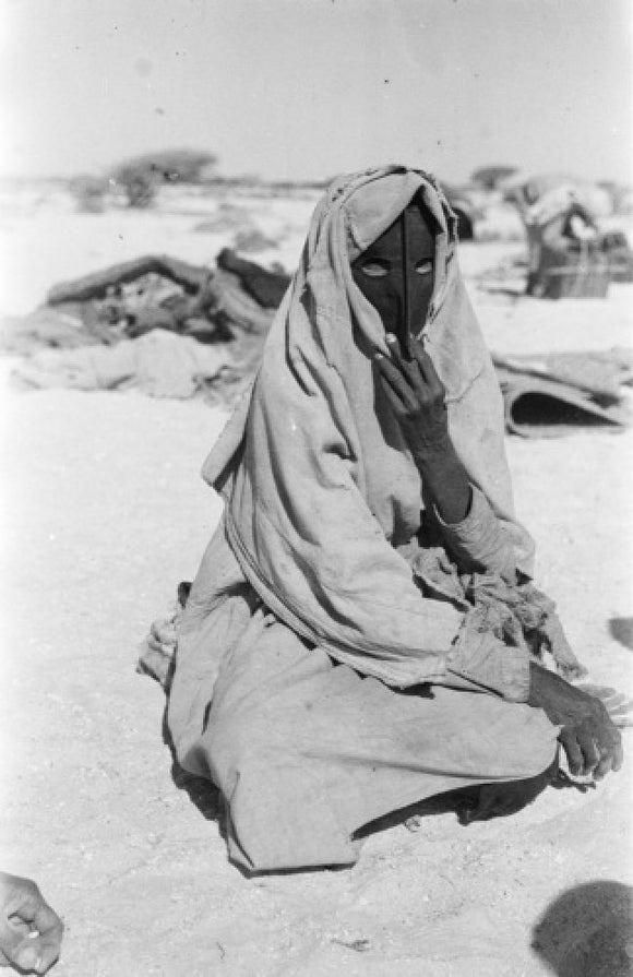 Harasis woman with a mask