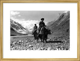 Kirghiz men riding yaks