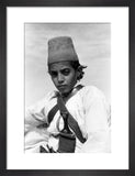 Arab boy wearing a conical hat