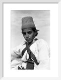 Arab boy wearing a conical hat