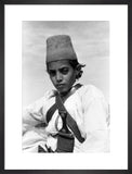 Arab boy wearing a conical hat