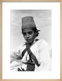 Arab boy wearing a conical hat