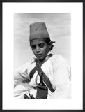 Arab boy wearing a conical hat