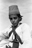 Arab boy wearing a conical hat