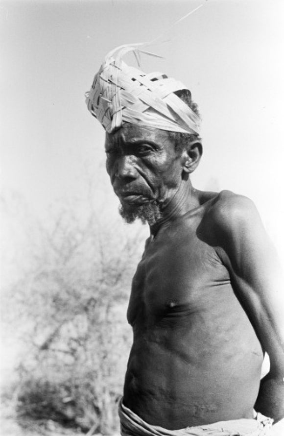 Arab slave wearing a palm frond hat