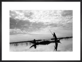 Madan men in a boat in the Marshes