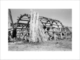 Suaid men constructing a house