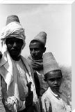 Arab men wearing conical hats