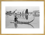 Suaid boy paddling a raft