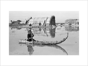 Suaid boy paddling a raft
