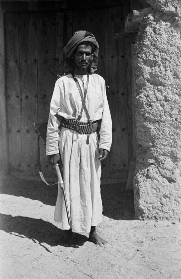 Musallim bin al Kamam with a rifle