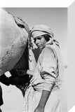 Rashid boy milking a camel