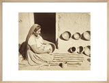 Woman polishing a pottery vessel