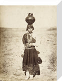 Pabla Tafolla carrying a pottery vessel