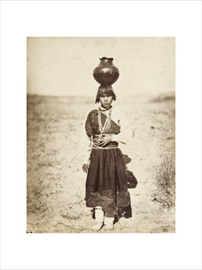 Pabla Tafolla carrying a pottery vessel
