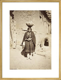 Zuni woman carrying a pottery vessel