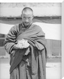 Monk holding the seal of Tsurphu