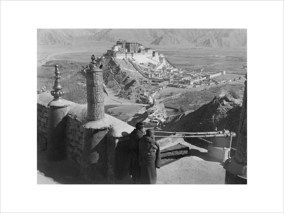Monks blowing radung, Potala in distance