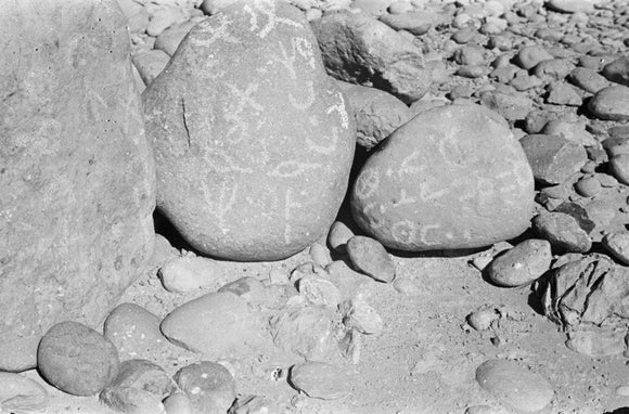 Three large boulders covered in ...