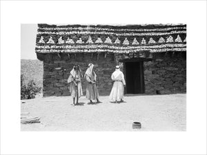 View of three men standing ...