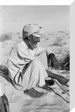 Seated profile portrait of an ...