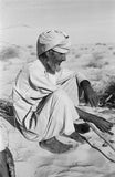 Seated profile portrait of an ...