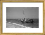 View of men unloading dhows ...