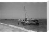 View of men unloading dhows ...