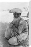Seated portrait of the Imam ...