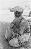 Seated portrait of the Imam ...