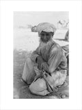 Seated portrait of the Imam ...