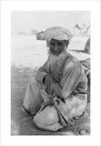 Seated portrait of the Imam ...