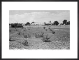 View of a field, houses ...