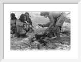 Wilfred Thesiger's party preparing food. ...