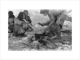 Wilfred Thesiger's party preparing food. ...