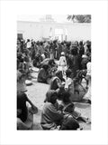View of traders sitting with ...